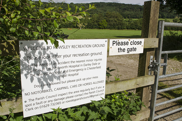 Image of signage and gate leading to the recreational ground in Rowsley